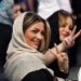 epa05974065 Iranian women flash the victory sign as they wait to cast their ballots in the Iranian presidential elections at a polling station in Tehran, Iran, 19 May 2017.  Out of the group of candidates, the race is tightest between frontrunners Iranian current president Hassan Rouhani and his conservative challenger Ebrahim Raisi.  EPA/ABEDIN TAHERKENAREH