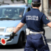 San Remo, Italy - June 10, 2018: Italian Policeman (Polizia Locale) in Uniform Controlling Road Traffic in The City Center of San Remo, Liguria, Italy